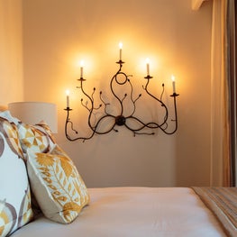 Beautiful and unique custom headboards and lighting.