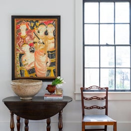 Vignette shot of vintage furnishings and original art