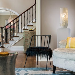 Black lambswool on a mod side chair and a lit sculpture for maximalism design!