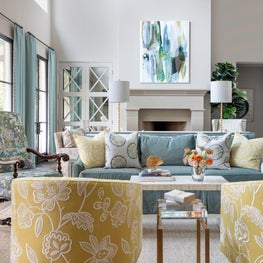 Transitional family room in a fresh color palette with floral fabric embroidery