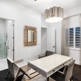 SLEEK CONTEMPORARY METALLIC RESIDENCE modern office, minimalist office, metalic sculptural pendant light, light gray midcentury modern chairs