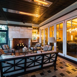 Screened Porch with 16th Century Celtic Stone Mantle and Folding Door