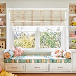 Built in window seat and bookcase with playful childrens accessories