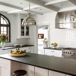 White Kitchen into Hall, subway tile, apron sink & bridge faucet, Lido marble.