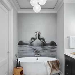Luxurious and relaxing bathroom with custom-fit, resin finished artwork. 