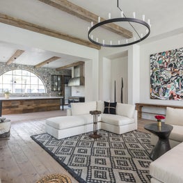 Grand family room open to kitchen with cashmere sofas; Houston, TX