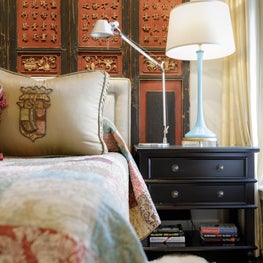 Nightstands highlighted with antique Murano lamps