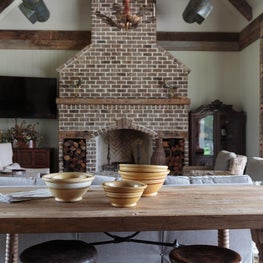 Great hearth and mantle of the fireplace serve as focal point for the cabana