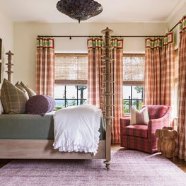 Botanicals, plaid, and a Tiffany chandelier create vintage vibe in this bedroom