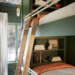 Colorful Green Bunk Room with Wallpapered Ceiling
