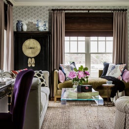 Layered living room with asian accents antiques wallpaper woven wood lucite 