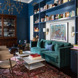 Detail shot of custom built bookshelves and wallpaper feature 