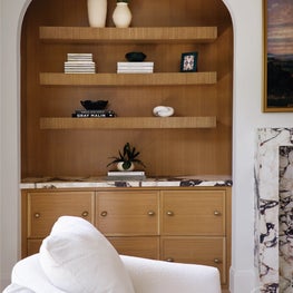 Layered textures and neutral tones create a warm gathering space that bridges elegance and everyday family living.