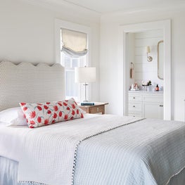 Girls bedroom in aqua and pink with custom headboard