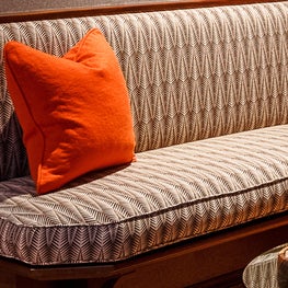 Neisha Crossland zebra linen on built-in bench - design by Sophia Shibles