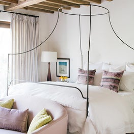 Guest Bedroom Vintage beams, Iron canopy bed, lavender, 