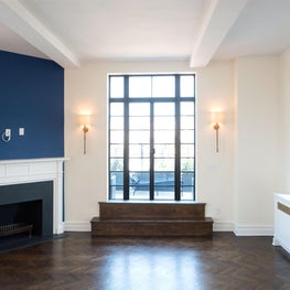 Custom Fireplace with Blue Accent Wall - Open Living Room