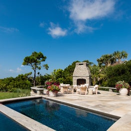 Pool, Spa and Stone Patio with Seating Area and Outdoor Fireplace