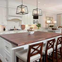 White Cabinetry with wooden island