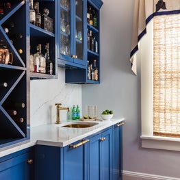 Custom designed blue bar and cabinetry in this historic Marthas Vineyard home.