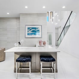 SLEEK CONTEMPORARY METALLIC RESIDENCE wet bar, modern bar, modern bar stools, open concept bar, club chairs, modern art
