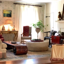 Historic preservation was the focus of this American Colonial Cottage including restoration of the original blue and white Ikat wallpaper.