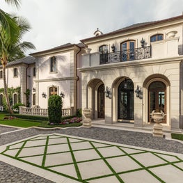 Limestone rustication at the entry of a David Adler inspired Palm Beach home