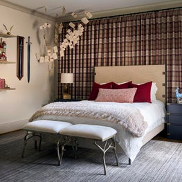 Portfolio: Floating shelves, curated collectibles, and custom furnishings transform this Harry Potter-inspired guest room into an immersive yet polished space.