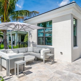 SLEEK CONTEMPORARY METALLIC RESIDENCE Luxury patio firniture, white pation, modern outdoor furniture, coastal living