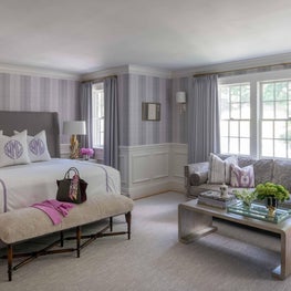 Master Bedroom with Upholstered Headboard and Bench with Sitting Area