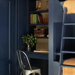 The second floor addition that extends over the original hunting lodge allowed us to create two new bedrooms for our client's sons.