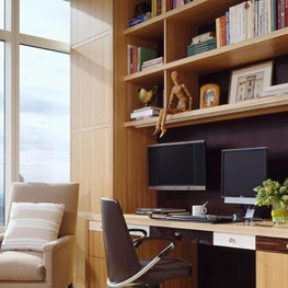 Home office in NYC apartment, built in shelves and desk, city view