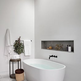 The primary bath of Braeswood Place is a lovely spot to enjoy some rest and relaxation.