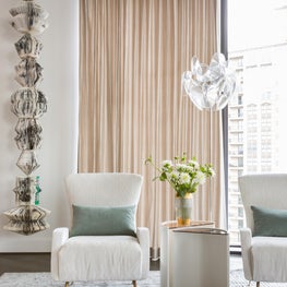 Portfolio: Houston high-rise living room with layered textures, colors and suspended totem