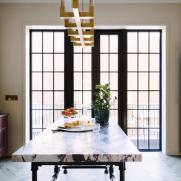 European Style Kitchen with marble workstation, casement doors, & two tone cabs 