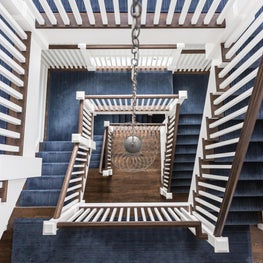 Square Stacked Staircase with Blue Runner, Chain Suspended Nickel Cage Pendant