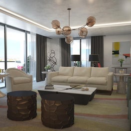 The sputnik chandelier draws attention skyward toward the cove lit ceiling.