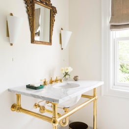 Seattle. Bath with antique Italian gilt mirror from JED Design and Antiques.