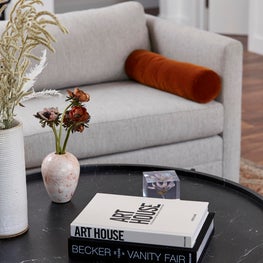 Minimalist Living Room Detail with Rust Accent & Marble Table