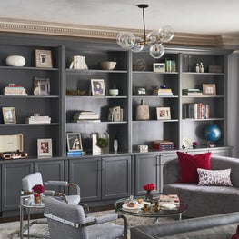 Large library area with wall of grey shelving