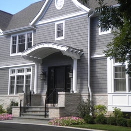 Grey Shingle Style New Construction Home with Craftsman Entry