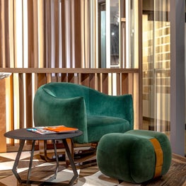 Milo Chair and ottoman, Fetish Table in showroomVignette - MB Collection 