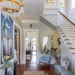 Layered foyer with vintage pieces, mixed metals and pattern
