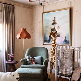 Nursery with Wooden Paneled Walls and Vintage Leather Floor Lamp