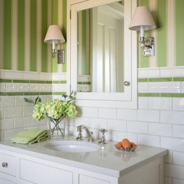 Contemporary farmhouse bathroom with sconces, green striped wallpaper
