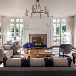 Hamptons Residence, Living Room w/ fireplace and modern chandelier