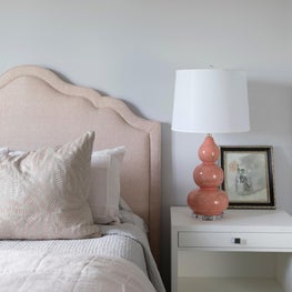 Custom upholstered bed in blush fabric for little girls room 