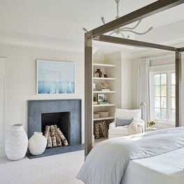 Master Bedroom, Noir Furniture Light Fixture, Circa Lighting Lamp, Soapstone Fireplace, Palecek Canopy Bed, Phillip Jeffries Wall Covering — Pine Lake Project