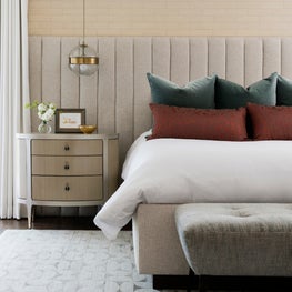 Portfolio: Neutral-toned master bedroom with tufted headboard and brass details