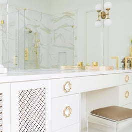 Portfolio: An all-white master bath with gold accents and delicate cabinet details
